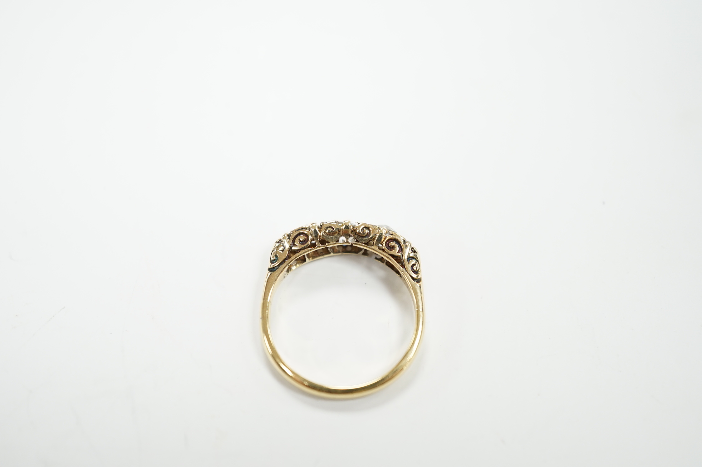 An 18ct and graduated five stone diamond set half hoop ring, size L, gross weight 2.8 grams (splits to setting).